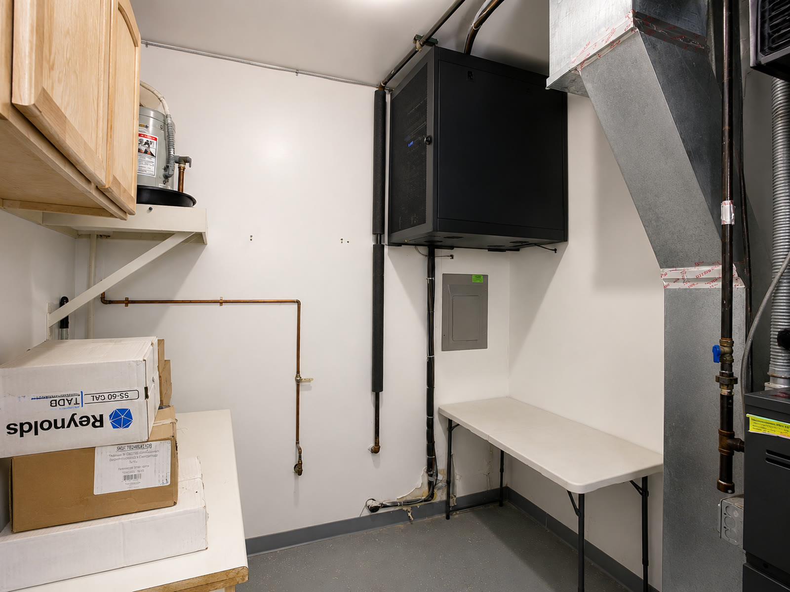 Larger enclosed network cabinet after replacement and cleanup.